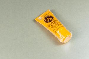 Lviv Ukraine 10.04.25 Cocoa butter cream tube placed on flat surface photo