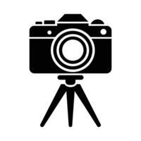 DSLR camera on a tripod, ready to capture. vector