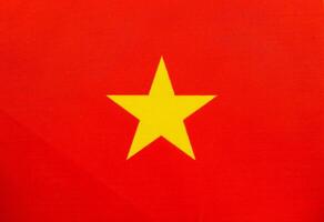 National flag of Vietnam with red background and yellow star photo