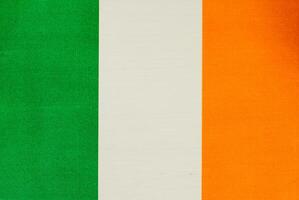 Irish flag displayed on a blue background photo