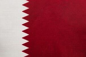 Qatar flag displayed prominently in a colorful setting photo