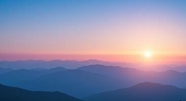 Sunrise Over Layered Mountain Ranges photo