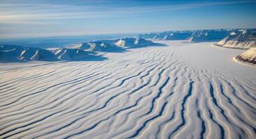 Arctic Glacier Aerial View Snow Waves, Mountains, and Frozen Fjord photo