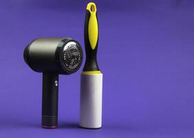 On a purple background there is a lint removal machine and a clothes roller photo