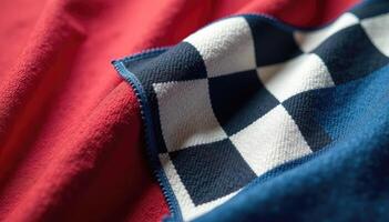 A close up of a red and white checkered blanket photo