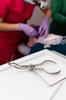 Surgeon performs intricate dental procedure with precise instruments and attentive care at a modern clinic, creating a comfortable environment for the patient photo