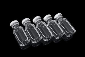 Vials with solution for injection on a black background photo