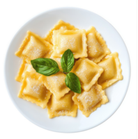 A plate of golden-brown tortellini pasta topped with fresh basil. png