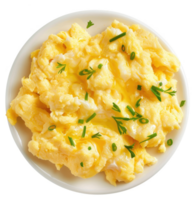 Scrambled eggs with chives and butter on a plate. png