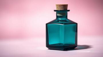A blue glass bottle with a cork on top photo