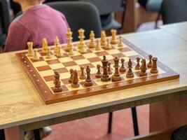 Chessboard with figures during a chess tournament in a school photo