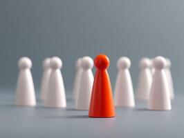 Red Game Piece Standing Out in a Group, Symbolizing Individuality Or Leadership in a Group Setting photo