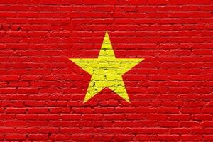 Vietnam Flag on an Aged Brick Wall with Grunge Texture photo