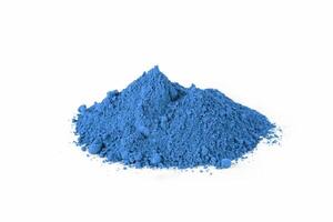 Vibrant Blue Pigment Pile on a White Background Showcasing Its Fine Texture and Rich Color Depth photo