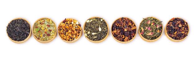 different types of tea on a white background. a kind of delicious tea, fruit tea. top view. photo