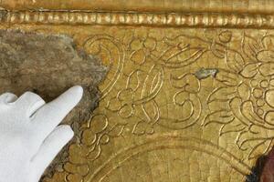 Restoration gold restoration, old icon. close up. conservation of paintings. photo