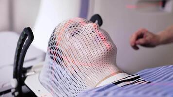Female in the oncology room of the computed tomography department is being prepared by specialists to diagnose the exact location of the tumor in her brain. Medicine concept, technology video