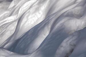 Wind sculpted patterns on snow surface photo