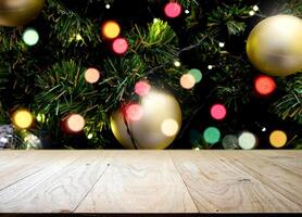 Empty old wooden table in front of Christmas or happy new year time background photo