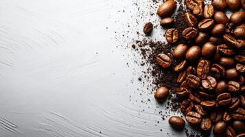 Coffee beans and grounds on a textured surface. photo
