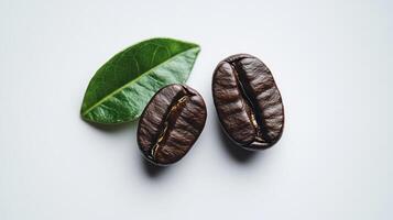 Coffee beans with a green leaf on a white background. photo