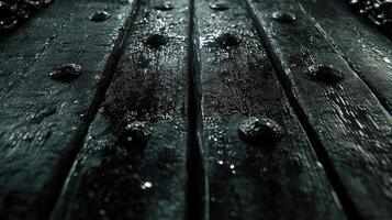 Close-up of textured wooden surface with rivets. photo