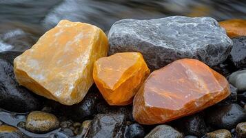 Colorful rocks by a flowing stream. photo