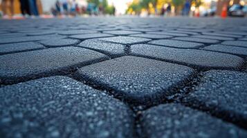 Close-up of textured pavement in a street setting. photo