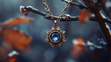A vintage necklace hanging from a branch. photo