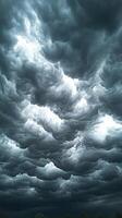 Dramatic dark clouds swirling in the sky. photo