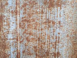Rusty Metal Surface Texture. This is a close-up of a weathered metal surface with rust forming an organic, abstract pattern. photo