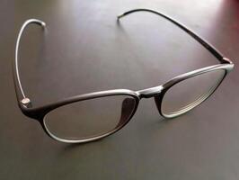 Classic Black Frame Reading Glasses. These glasses feature a sleek, classic black frame with clear lenses for reading. photo