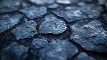 Close-up of cracked asphalt surface. photo