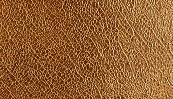 Textured gold leather surface pattern close-up abstract design photo