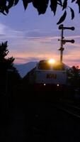 3. 11 August 2024, View of a train passing through the countryside with natural scenery photo