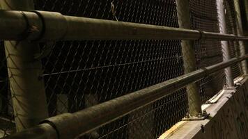 6 Wire mesh bridge on the side of the road photo