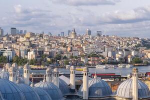 The skyline of Istanbul is visible with the Bosphorus River, Galata Tower, photo