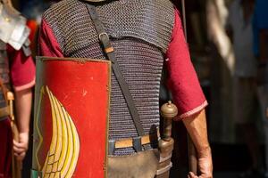 roman soldiers seen from behind with shields roman military formation viewed from behind photo