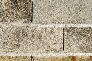 closeup view of a wall made of cement blocks, background with construction concept texture photo