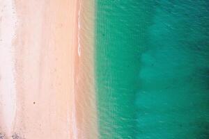 beach aerial view clear water shoreline coastal patterns, top down view aerial drone photo. Summer concept background photo