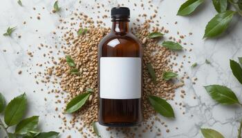 Amber Bottle Surrounded by Sesame Seeds and Green Leaves on a Marble Surface photo