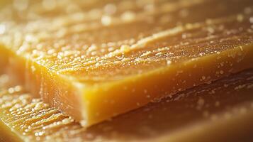 Close Up of Golden Honeycomb Texture, Sweet Treat Background. photo