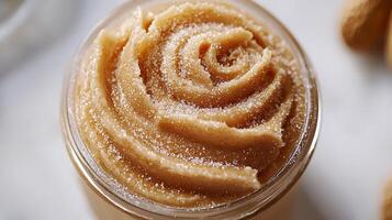 Close up of Homemade Peanut Butter with Sugar Crystals in a Jar. photo