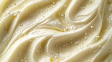 Creamy Swirled Frosting Texture Close Up of Delicious Vanilla Buttercream. photo