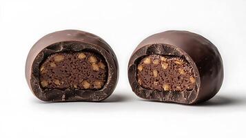 Indulgent Dark Chocolate Bonbons with Nut Filling A Close Up View of Two Broken Chocolates. photo