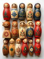 colorfutraditionally painted matryoshka dolls are arranged on a light surface, some accompanied by small decorative natural elements photo