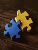 Two puzzle pieces, one blue and other yellow, symbolize connection and teamwork in creative way photo