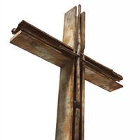 Rustic wooden cross with weathered appearance, showcasing blend of textures and colors, symbolizing faith and spirituality photo