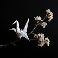 white origami bird on black background brings sense of peace and tranquility. This still life evokes feeling of serenity and delicate beauty photo