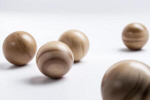 wooden ball, isolate, white, studio, light, smooth. wooden balls rest peacefully, their smooth surfaces reflecting light in isolated studio setting photo